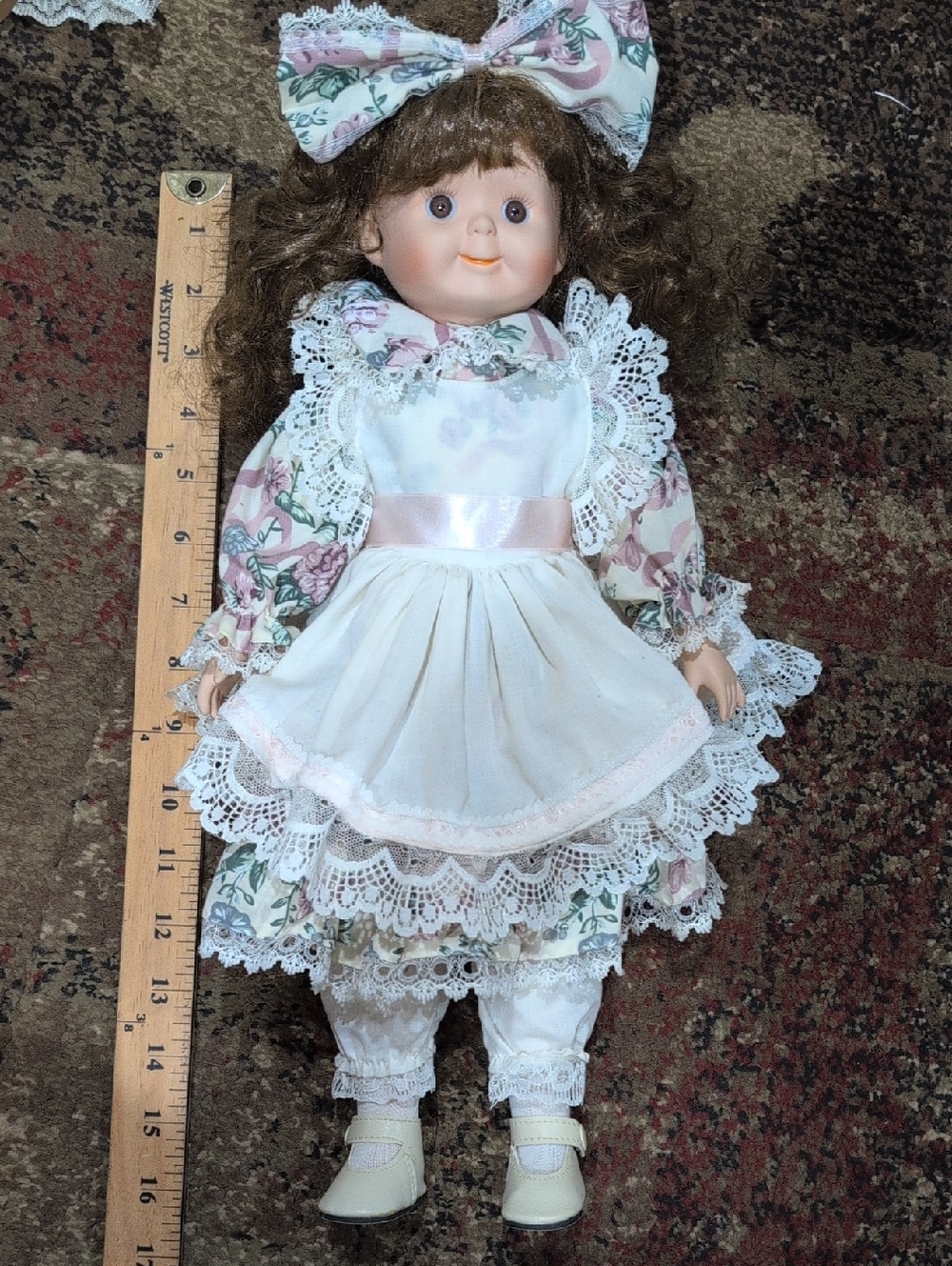 Porcelain Collector Doll with Floral Dress and White Apron